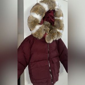 Brand new. Never worn Jordan Craig burgundy coat size 12, very durable.